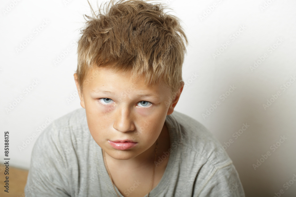 Portrait of blonde young unfriendly teenager Portrait of blonde young unfriendly teenager