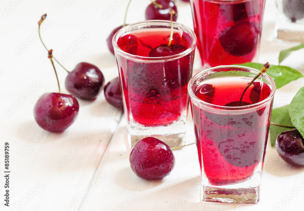Fresh cherry juice with berries, selective focus Fresh cherry juice with berries, selective focus