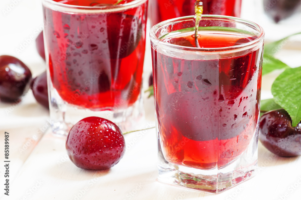 Fresh cherry juice with berries, selective focus Fresh cherry juice with berries, selective focus