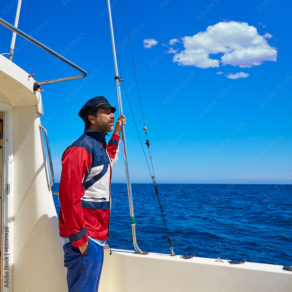 Beard sailor man sailing sea in a boat captain cap