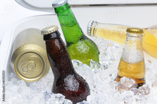 Assorted Beer Bottles and Cans in Cooler