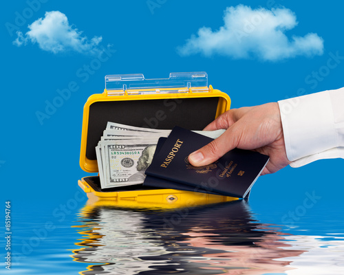 Person retrieving goods from a water resistant case photo