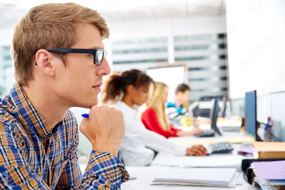 Blond businessman young in office with computer Blond businessman young in office with computer