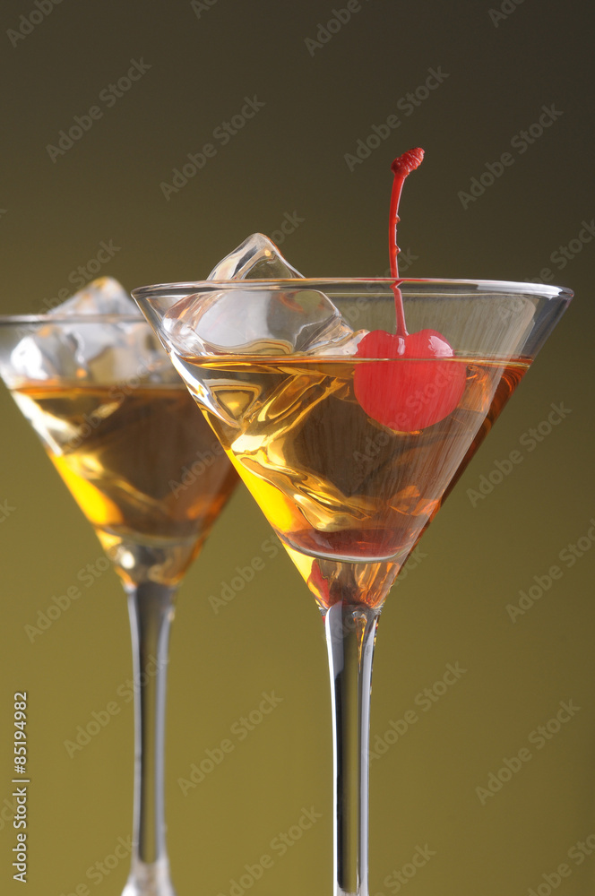 Two Manhattan Cocktails in Martini Glasses Two Manhattan Cocktails in Martini Glasses