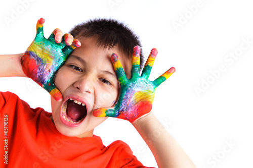 Little boy with hands painted in colorful paint