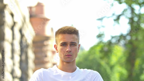 The invalid man sit and ride in the wheel chair in the crowd stream at sidewalk