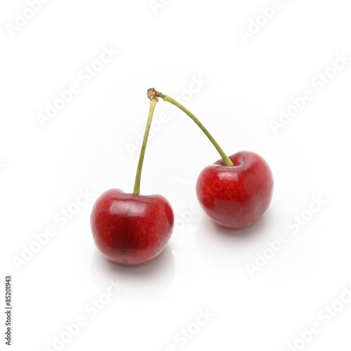 Ripe red cherry berries isolated on white background