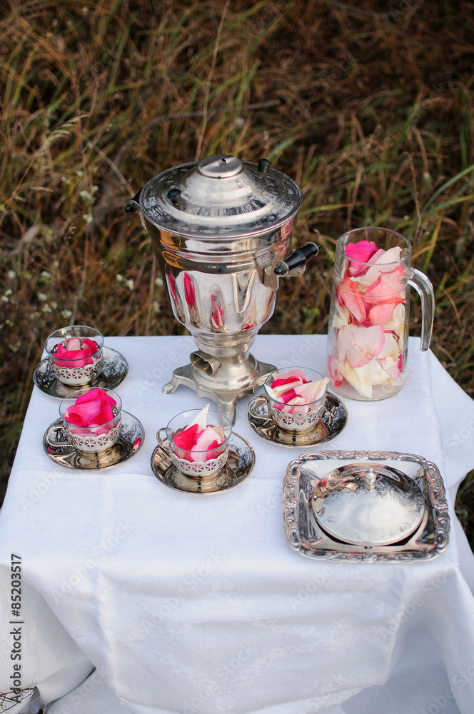 The decor of silver samovar and cups