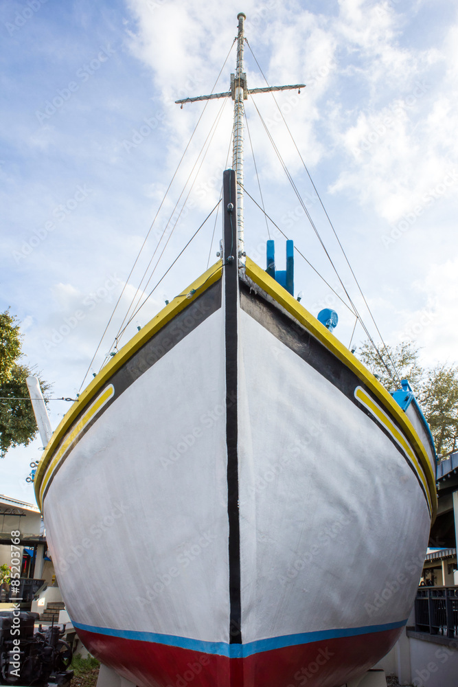 White Ship Front - White Wooden Ship with Yellow Blue and Red Trim On Display in Tarpon Springs Florida.