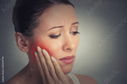 woman with sensitive tooth ache crown problem about to cry from pain