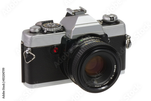 Classic 135 format SLR camera on a white background - isolated
