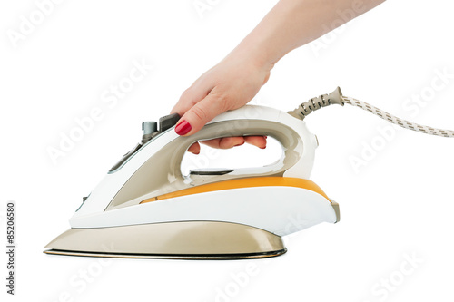 Картината върху платно Woman hand and flat iron