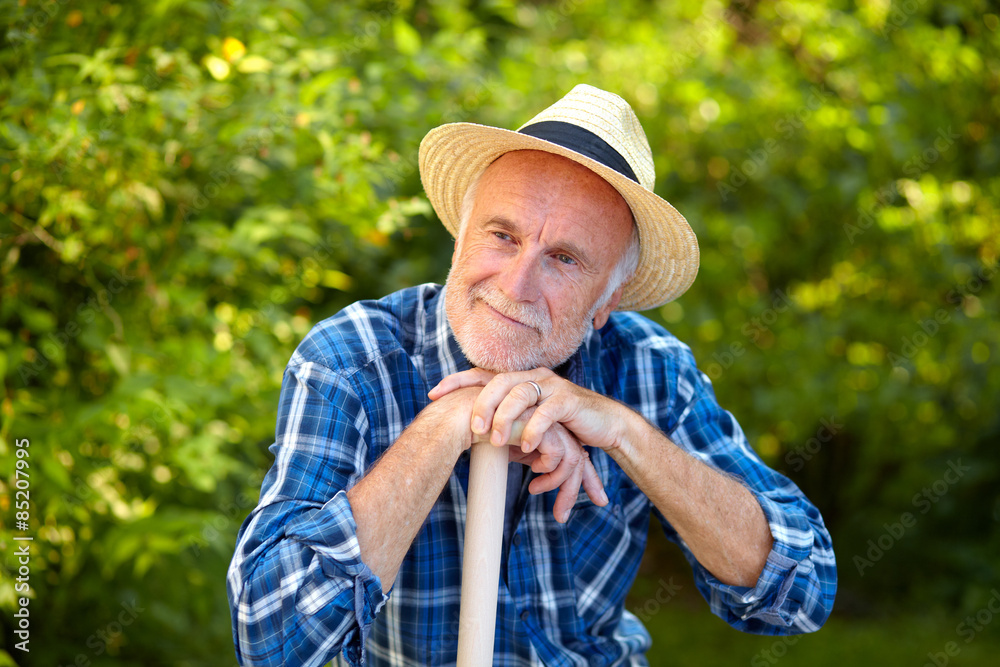 Fototapeta premium Senior man in garden take a break