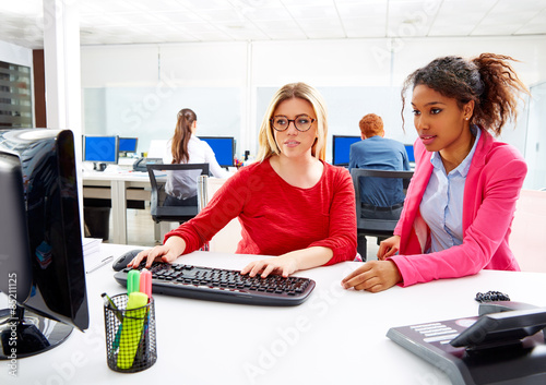 Businesswomen team working at offce desk photo