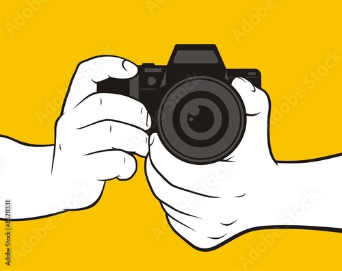 Hands holding camera