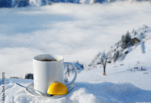 Nice warm cup of tea or coffee outdoors in the snowy scene