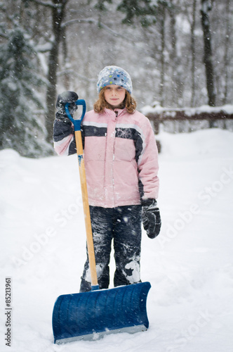 girl with a snow shovel