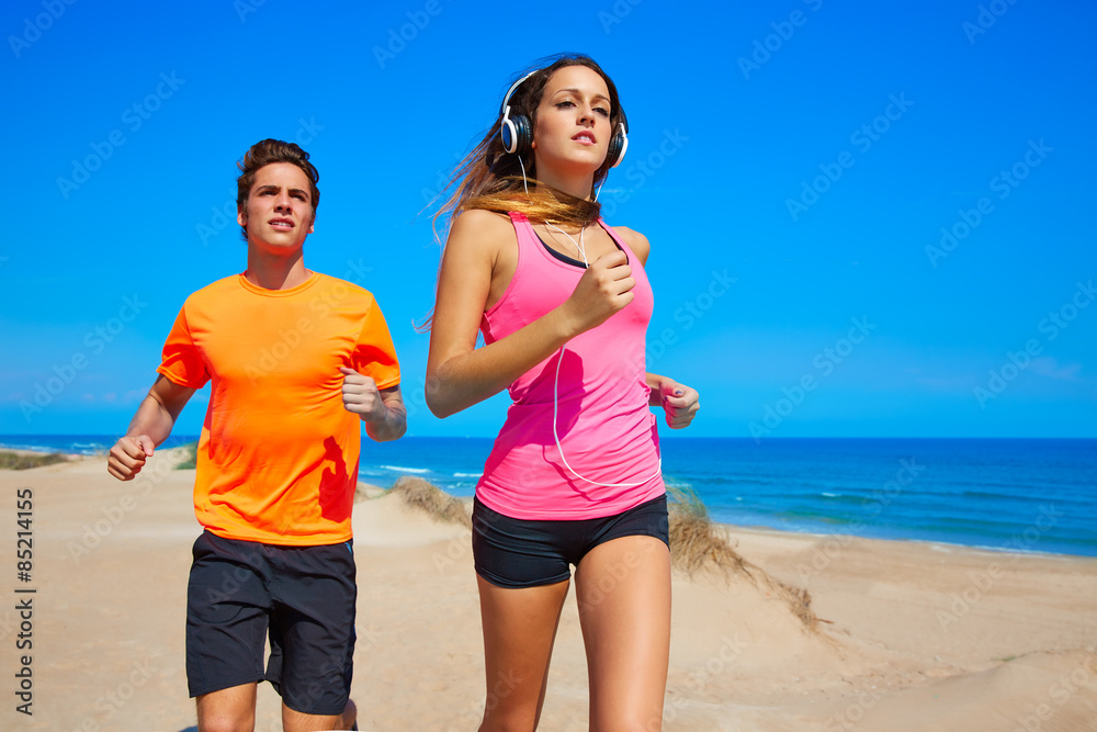 Couple young running in the beach in summer
