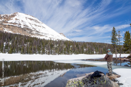 Man fishing in mountain Mirror Lake. Uinta-Wasatch-Cache Natio