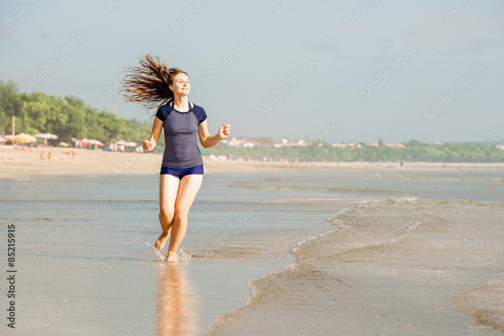 Healthy woman running on the beach, girl doing sport outdoor Healthy woman running on the beach, girl doing sport outdoor