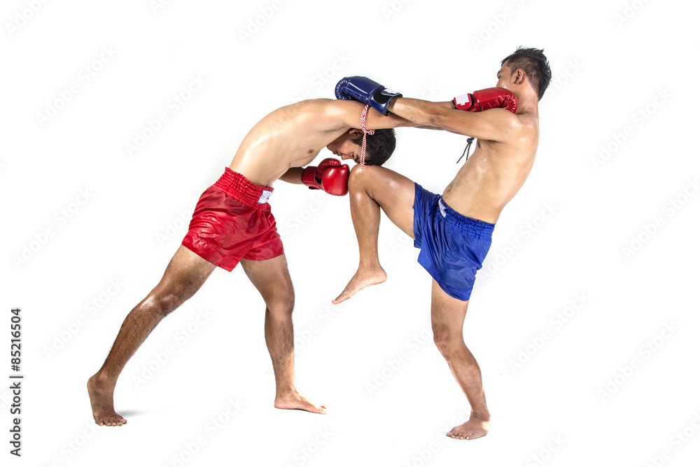 Two thai boxers exercising traditional martial art