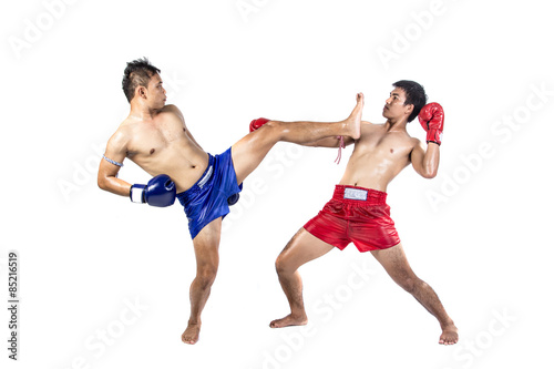 Two thai boxers exercising traditional martial art