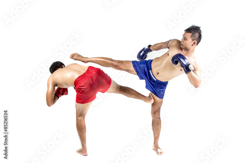 Two thai boxers exercising traditional martial art