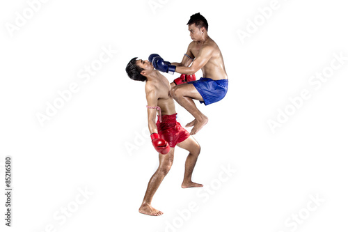 Two thai boxers exercising traditional martial art © kromkrathog