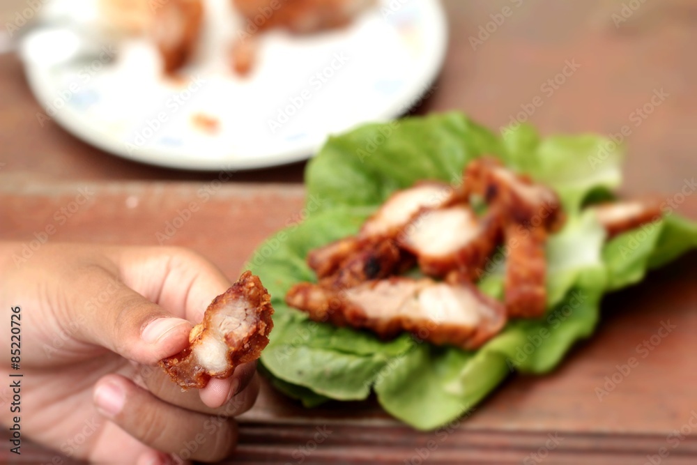 Pork fried with vegetables in hand. Pork fried with vegetables in hand.