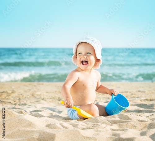 Baby playing at the sea