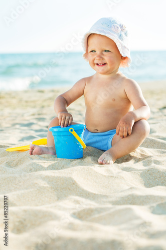 Baby playing at the sea