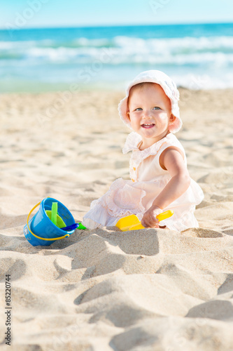 Baby playing at the sea
