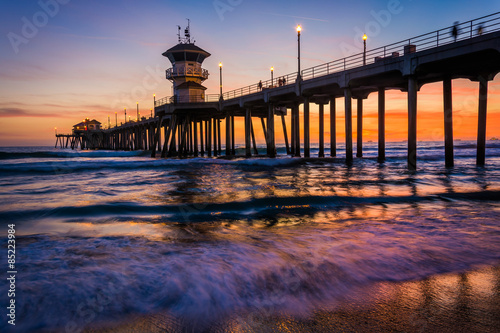 Waves in the Pacific Ocean and the pier at sunset  in Huntington