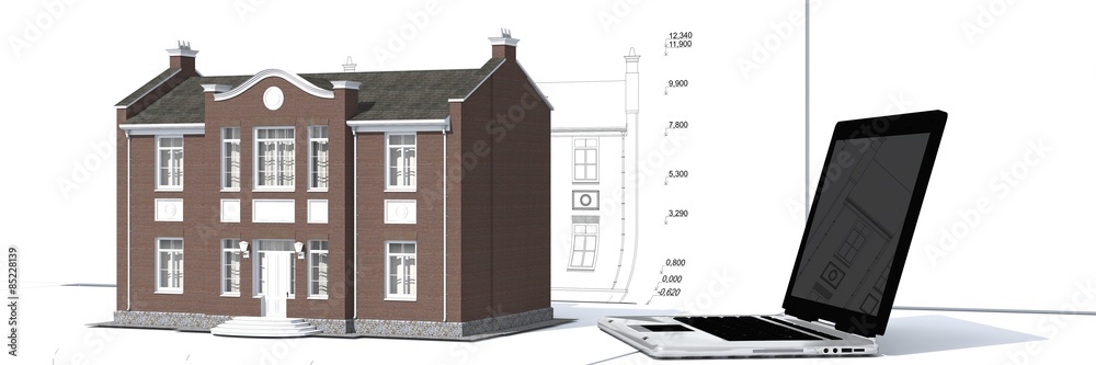 Obraz premium Model of house and laptop on the table