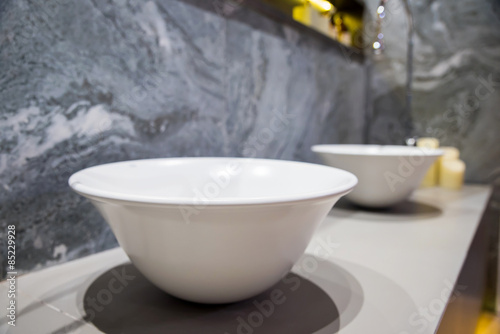 Modern faucet and wash basin in luxury bathroom 