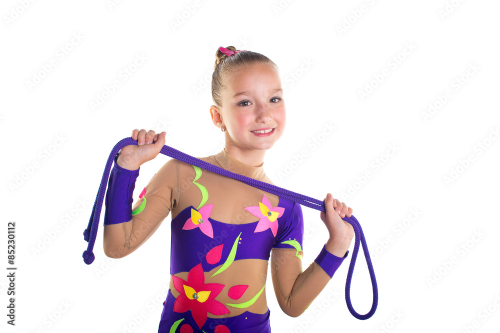 Young beautiful sport girl doing gymnastic exercises with jumping rope Young beautiful sport girl doing gymnastic exercises with jumping rope