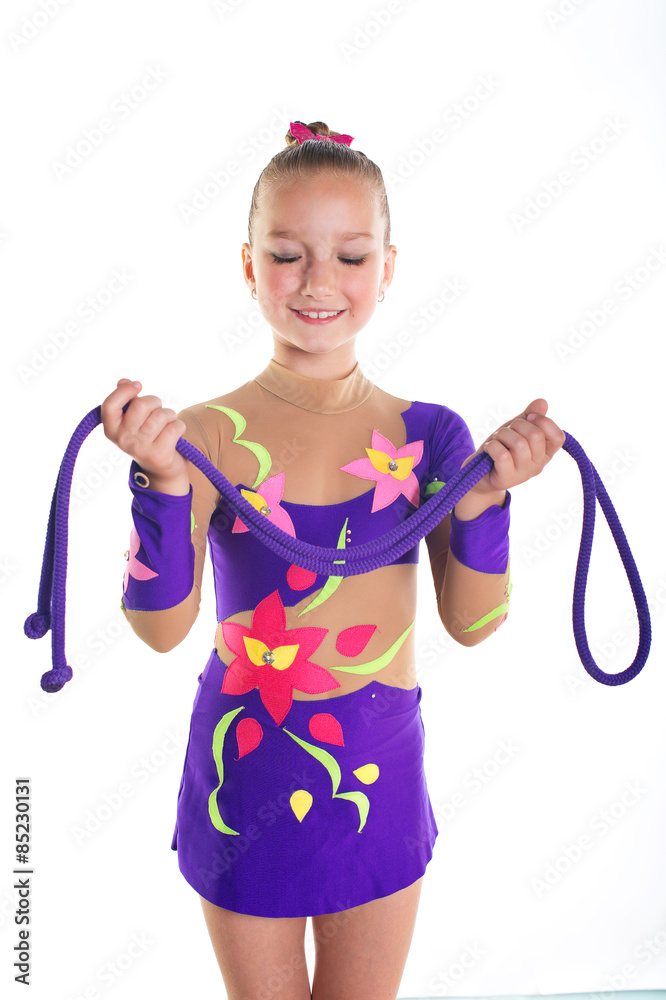 Beautiful toddler sport girl with purple rhythmic gymnastic suit and rope Beautiful toddler sport girl with purple rhythmic gymnastic suit and rope