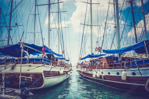 Two moored sailing boats - retro and vintage style