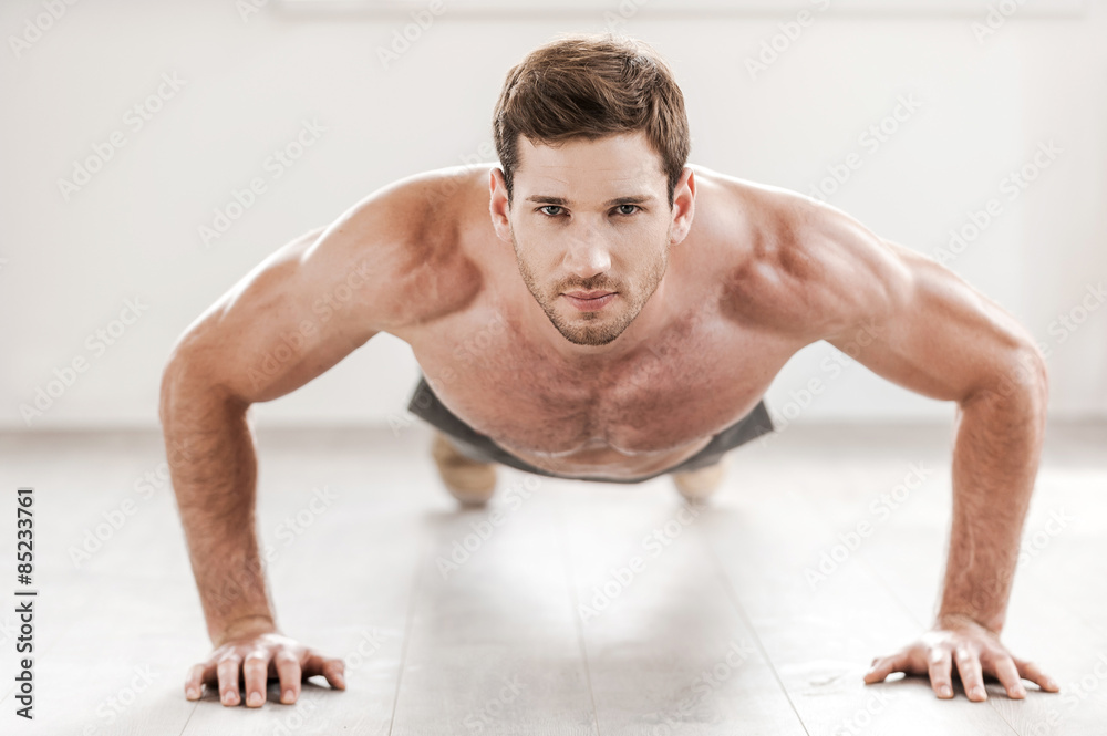 Confident man doing push-ups. Confident man doing push-ups.