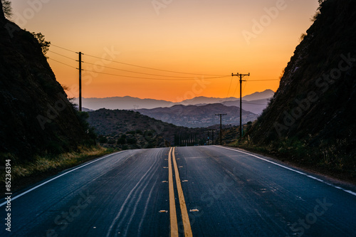 Sunset over distant mountains and Escondido Canyon Road, in Agua photo