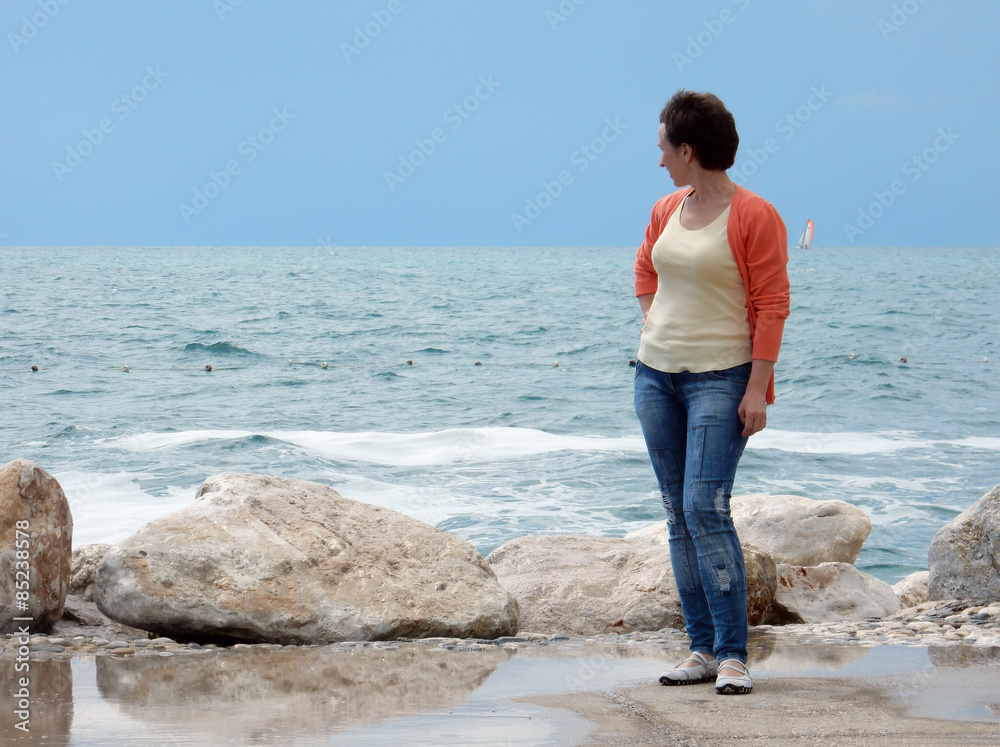 woman looks at sea