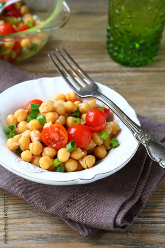 Chickpeas with tomatoes and onions on a plate