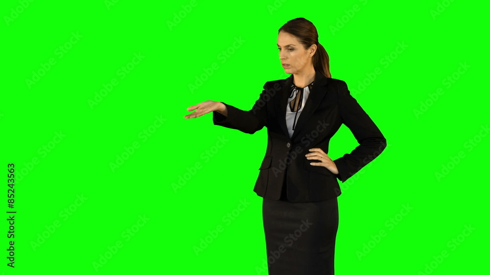 Businesswoman wearing something with her hands on green screen Businesswoman wearing something with her hands on green screen