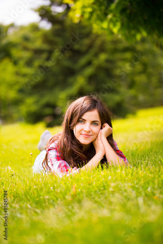 Girl lying on the grass in the park