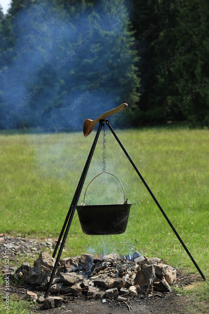 Cooking in cauldron Cooking in cauldron