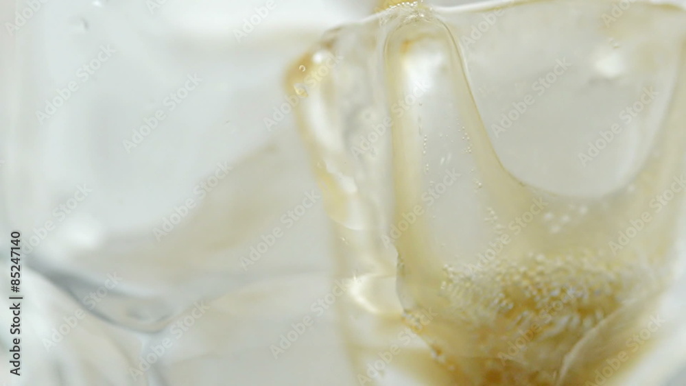 Close-up pouring Cola with Ice Close-up pouring Cola with Ice