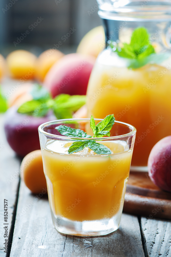 Sweet fresh peach juice with ice