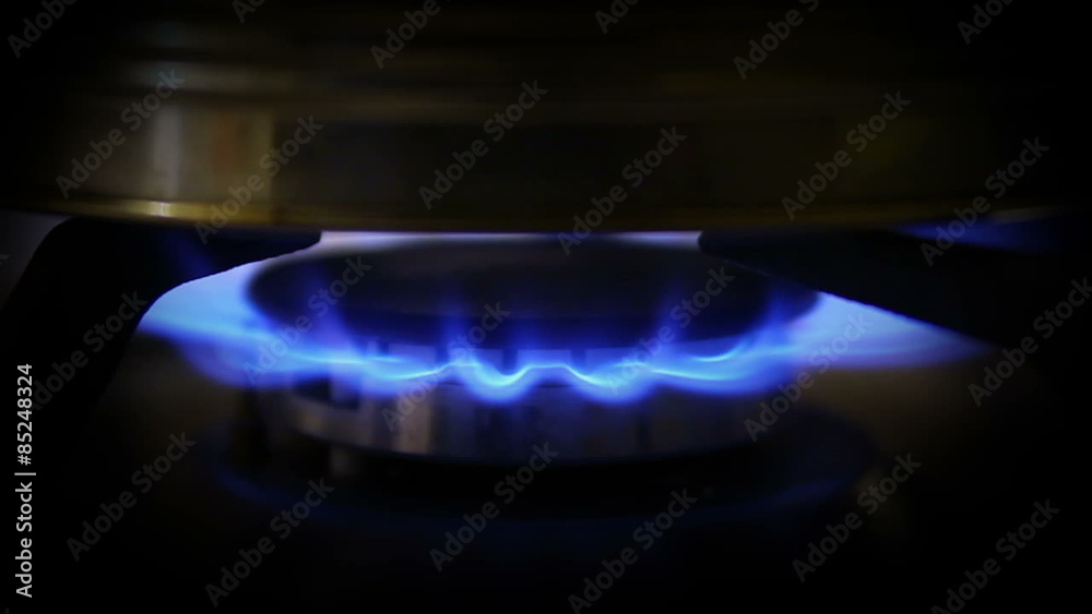 Tea Set on a Gas Stove in the Dark Tea Set on a Gas Stove in the Dark