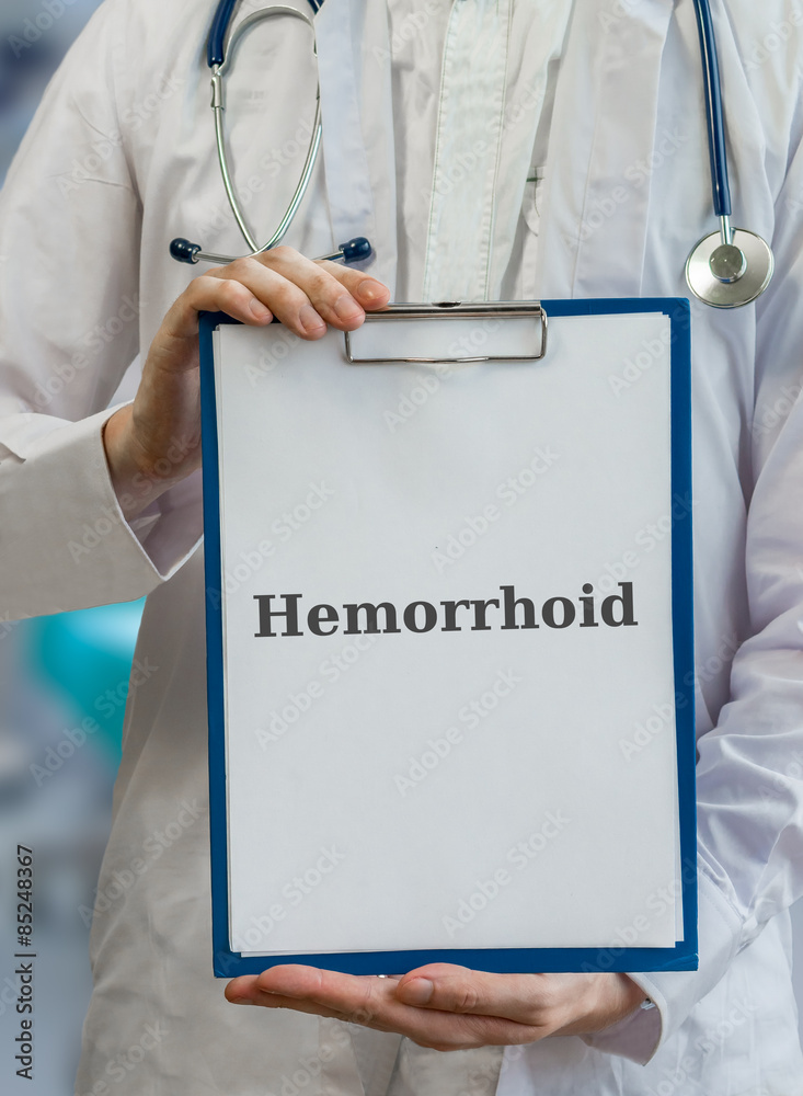 Doctor holds clipboard with hemorrhoid diagnosis Doctor holds clipboard with hemorrhoid diagnosis