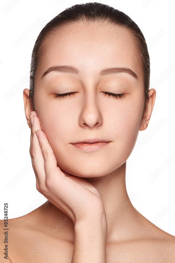 Portrait of beautiful girl stroking her face with healthy skin Portrait of beautiful girl stroking her face with healthy skin